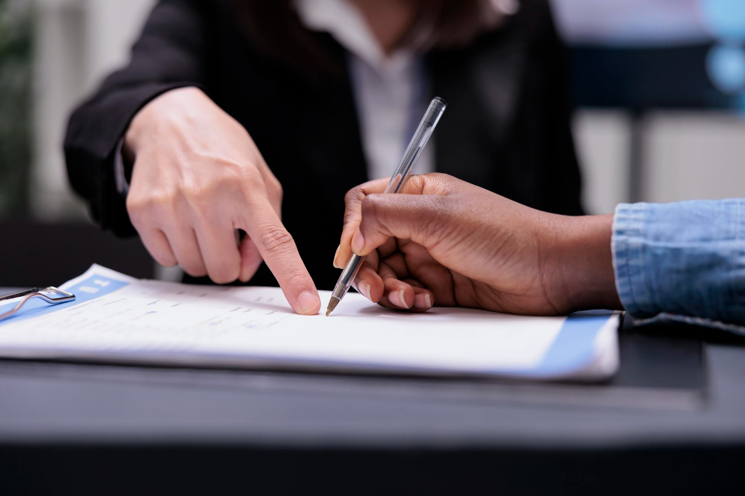 a person filling a form
