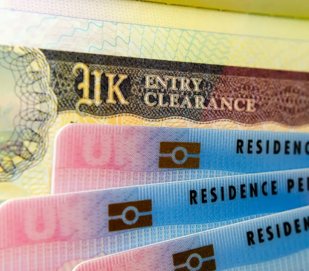 UK Family Visa documents showing British passport and biometric residence permit for dependents